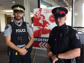 RCMP Cpl. Richard Nowak, left, and Edmonton Police Service Det. Braydon Lawrence at the 22nd International Council on Alcohol, Drugs and Traffic Safety Conference in Edmonton on Sunday, Aug. 18, 2019.