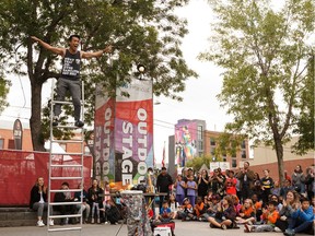 Street performer Eden cheers with the audience during his outdoor stage show at the Edmonton International Fringe Theatre Festival on Aug. 19, 2019. On Monday it was announced the 39th annual Edmonton International Fringe Theatre Festival has been cancelled because of the COVID-19 pandemic.