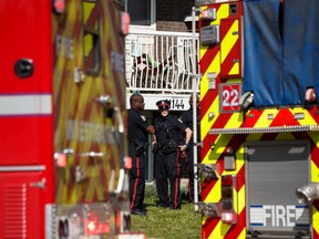 Edmonton Police Service officers and Edmonton Fire Rescue Services firefighters responded to a fire in a building at 11144 124 Street in Edmonton, on Tuesday, Aug. 20, 2019. Nine people were evacuated due to the fire and 124 Street was closed during the subsequent investigation.