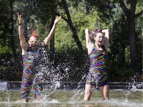 Fridge performers Spandy Andy and Mandi take some publicity photos in the Legislature wading pool on Tuesday, Aug. 20, 2019, in Edmonton.