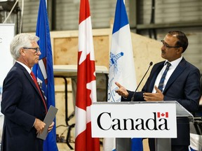 Amarjeet Sohi (right), MP and Minister of Natural Resources, and Jim Carr, Minister of International Trade Diversification are seen during a federal announcement of $1.5 million in funding at the Alberta Centre for Advanced MNT Products (ACAMP) technology incubator at Edmonton International Airport, on Thursday, Aug. 22, 2019. Photo by Ian Kucerak/Postmedia
