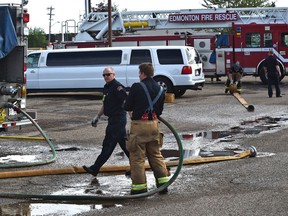 Firefighters still on the scene of a suspected arson in this early morning fire at Diamonds Gentlemen's Club on 4635 Gateway Blvd. in Edmonton, August 24, 2019. Ed Kaiser/Postmedia