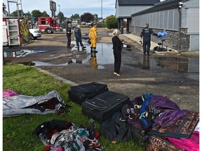 Personal items taken from building as firefighters are still on the scene of a suspected arson in this early morning fire at Diamonds Gentlemen's Club on 4635 Gateway Blvd. in Edmonton, August 24, 2019. Ed Kaiser/Postmedia