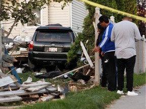 A Toyota 4Runner is seen in a backyard after a driver crashed into a home at 3403 24 St. in Edmonton, on Monday, August 26, 2019.