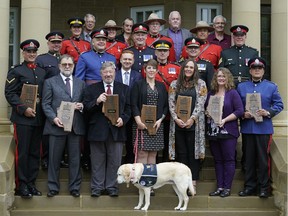 Recipients and participants of the 28th Annual Alberta Community Justice Awards outside Government House in Edmonton on Friday August 30, 2019. The Government of Alberta and RCMP K Division honoured individuals and organizations who demonstrated leadership, innovation, service enhancement, community mobilization, and collaboration in crime-prevention and restorative justice to help improve community safety.