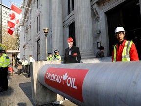 Demonstrators in 2018 used a mock oil pipeline to block the entrance to the Canadian Embassy in central London, as they protest against the Trans Mountain oil pipeline from Alberta's oil sands to the Pacific Ocean. On June 18, 2019, the Canadian government, gave a green light to the controversial Pacific pipeline expansion.