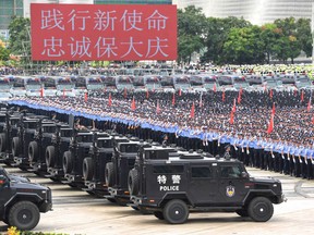 This file photo taken on August 6, 2019 shows Chinese police officers taking part in a drill in Shenzhen in China's southern Guangdong province, across the border from Hong Kong.