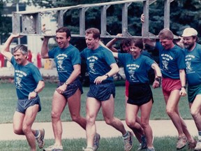 Edmonton's Back of the Pack gang, which carried a three-metre ladder on 42-km marathon runs and sold signage on rungs to raise funds for charities. It celebrated its 30th anniversary last weekend. The runners training for an early race are Larry Clark; left, John Stanton; Jim Taylor; Heather Dunlop, with Bev McNally just behind her; the late Drew Hutton; Nick Lees and Yardley Jones. The group raised hundreds of thousands of dollars for charity.