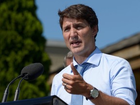 Canada's Prime Minister Justin Trudeau speaks about a watchdog's report that he breached ethics rules by trying to influence a corporate legal case regarding SNC-Lavalin.