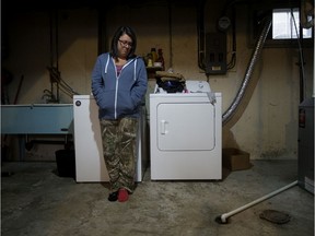 Katie Rideout in the basement of her Griesbach home on Friday, Aug. 16, 2019. Rideout's basement was flooded with approximately one metre of sewage.