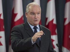 Conservative MP Erin O'Toole speaks during a news conference, Wednesday October 11, 2017 in Ottawa. Several Conservative officials are arguing that new electoral laws should not apply retroactively, after they were required to return the proceeds from two fundraising events held earlier this year. The Tory electoral district associations in Mississauga--Streetsville and Durham returned to donors funds connected to two events in January, one attended by Conservative Deputy Leader Lisa Raitt and the other by foreign affairs critic Erin O'Toole.