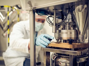 Dr. Raimar Löbenberg adjusts manufacturing equipment in one of Applied Pharmaceutical Innovation's main collaborating facilities, the Drug Development and Innovation Centre.