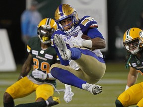 Winnipeg Blue Bombers Andrew Harris makes a leaping reception during Canadian Football League game action against the Edmonton Eskimos in Edmonton on Friday August 23, 2019. (PHOTO BY LARRY WONG/POSTMEDIA)