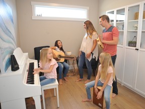 The Peters have turned the home office into a music room and an area next to the kitchen into a family study and staging area in their new home by Coventry Homes in St. Albert.