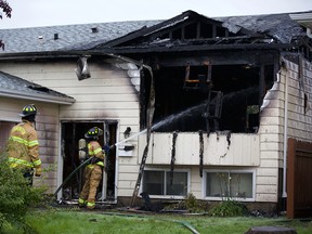 Edmotnon firefighters respond to a house fire in southeast Edmonton, at 4931 31 Ave NW, on Friday, Aug. 30, 2019.