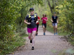 Joggers take part in a 'Take Back Our Trails' run through Edmonton's river valley, following a series of groping incidents over the summer, Friday Sept. 13, 2019. Photo by David Bloom