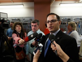 Advanced Education Minister Demetrios Nicolaides is interviewed about post secondary policy by the media at a government announcement of $10 million over four years in funding for Women Building Futures in Edmonton, on Thursday, Sept. 19, 2019. Photo by Ian Kucerak/Postmedia