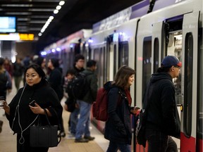 Travellers take the LRT at Central LRT station in Edmonton, on Tuesday, March 26, 2019.