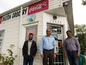 (Left to right) Harjinder Sokhal, his father Kulwinder Sokhal and Kulwinder's brother Gumeet Singh, seen outside the store in Edmonton, on Friday, Aug. 23, 2019, are multigenerational owners of the Delton Grocery Store which is being designated a Municipal Historic Resource.