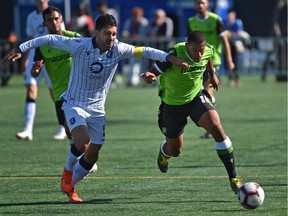 FC Edmonton Ramon Soria Alonso (5) tries to keep up with York9 FC Ryan Telfer (R) battle for the ball during action in the Canadian Premier League at Clarke Field in Edmonton, August 25, 2019. Ed Kaiser/Postmedia