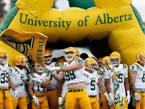 The University of Alberta Golden Bears enter Foote Field to face the Calgary Dinos during the U of A's home opener at Foote Field in Edmonton, on Friday, Aug. 30, 2019.