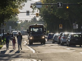 Students and parents walk to McKernan School on the first official day of school on Tuesday, Sept. 3, 2019.