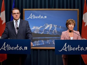 Energy Minister Sonya Savage and Environment and Parks Minister Jason Nixon discuss a joint initiative at McDougall Centre in Calgary on Friday, Sept. 6, 2019. Government is seeking input from stakeholders and the public to improve the Alberta Energy Regulator.