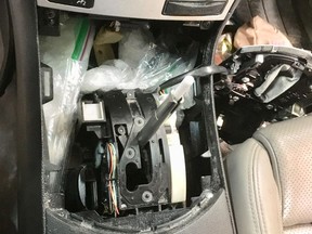 A photo of a hidden compartment where Edmonton police discovered a handgun with a magazine and ammunition during a recent drug trafficking investigation. (Supplied photo/EPS)