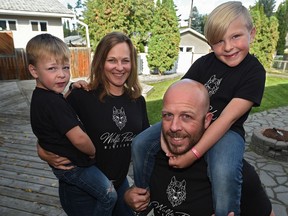 Kristy and Harrison Wolfe, with sons Kane (R), 6 and Maverick, 4. Kane was born with scoliosis and congenital heart conditions and he's going for his second heart surgery Monday. His family is selling 'Wolfe pack' shirts and giving profits to the children's hospital in recognition of the care they've received in Edmonton, September 20, 2019. Ed Kaiser/Postmedia