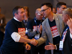 Premier Jason Kenney (left) shakes hands with Grande Prairie Mayor Bill Given after a keynote speech at the Alberta Urban Municipalities Association's convention at the Edmonton Convention Centre on Friday, Sept. 27, 2019. Photo by Ian Kucerak/Postmedia