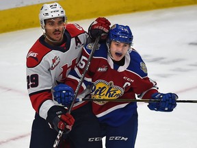 Edmonton Oil Kings Scott Atkinson (15) and Lethbridge Hurricanes Koletrane Wilson (29) battle in front of the net during WHL action at Rogers Place in Edmonton, September 29, 2019. Ed Kaiser/Postmedia