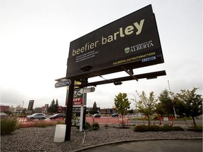 A University of Alberta billboard that suggests that climate change could result in a beefier barley yields, along 178 Street near 100 Avenue, in Edmonton Monday Sept. 30, 2019. University of Alberta vice-president Jacqui Tam has resigned her post over the billboard.