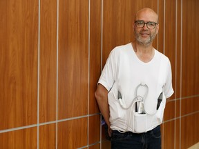 Brad Smoliak, a patient at the Mazankowski Alberta Heart Institute in Edmonton, poses for a photo wearing his ventricular assist device (VAD) at the University Hospital Foundation announcement of a $10 million donation on Thursday, Sept. 5, 2019. Photo by Ian Kucerak/Postmedia