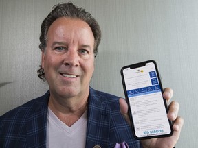 Graham Murray, president of ARC Business Solutions, on Wednesday, Sept. 4, 2019, with the CommuniBee app that he created.