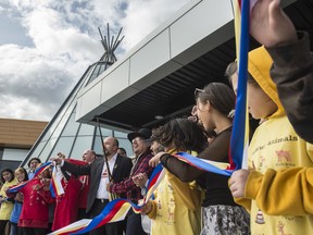Enoch Chief Billy Morin cuts the ribbon on the Maskêkosak Kiskinomâtowikamik K-12 school during the grand opening at Enoch Cree Nation on Wednesday, Sept. 25, 2019.