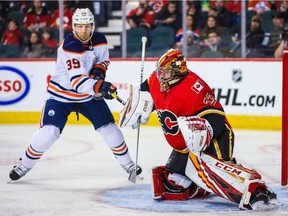 Sep 28, 2019; Calgary, Alberta, CAN; Calgary Flames goaltender David Rittich (33) makes a save as Edmonton Oilers right wing Alex Chiasson (39) tries to score during the second period at Scotiabank Saddledome. Mandatory Credit: Sergei Belski-USA TODAY Sports ORG XMIT: USATSI-406700