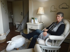 Marilyn Clouston sits on Friday, Oct. 4, 2019, in one of two refurbished Mother’s Rooms which she helped to decorate and which is the same room she stayed in with her son more than 30 years ago at Edmonton’s Ronald McDonald House.