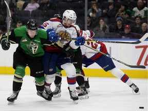 The Edmonton Oil Kings' Scott Atkinson (15) battles the Prince Albert Raiders' Eric Pearce (23) during Game 4 of the WHL Eastern Conference Championship third period action at Rogers Place, in Edmonton Wednesday April 24, 2019. The Raiders won 2-1. Photo by David Bloom