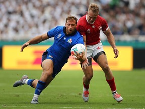 Tommaso Benvenuti of Italy, left, competes for the ball with Ben Lesage of Canada  during their Rugby World Cup 2019 Group B game at Fukuoka Hakatanomori Stadium on Sept. 26, 2019 in Fukuoka, Japan.