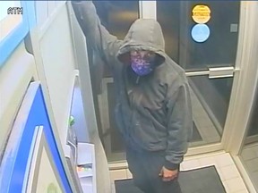 RCMP are looking for three unknown individuals, one of whom is pictured here, after an ATM was stolen in Morinville early Monday morning. Supplied.