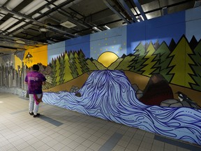 This art mural in the underground Churchill pedway was created by artists Jonathon Cardinal, Mehkwna Lynch, Destry Roan and Dana Belcourt. Indigenous people are vastly over-ticketed and warned on the Edmonton Transit System. Tickets overall have also nearly tripled since 2009 as turnstiles and other basic infrastructure remains absent. (PHOTO BY LARRY WONG/POSTMEDIA)