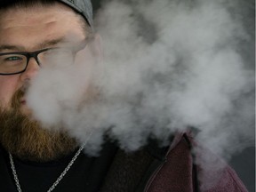 Richard Szabo with Vape Crave, 8411 109 St., exhales as he vapes outside the store, in Edmonton Monday Sept. 9, 2019. Photo by David Bloom