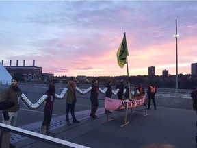 Climate activists block Walterdale Bridge during the morning commute in downtown Edmonton.