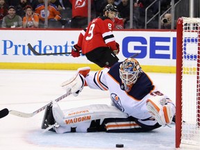 NEWARK, NEW JERSEY - OCTOBER 10: Mikko Koskinen #19 of the Edmonton Oilers makes the overtime save on Taylor Hall #9 of the New Jersey Devils at the Prudential Center on October 10, 2019 in Newark, New Jersey. The Oilers defeated the Devils 4-3 in the shoot-out.