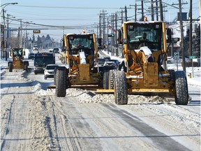 A team of graders clearing snow along 52 Ave. near 97 St. in Edmonton. File photo.
