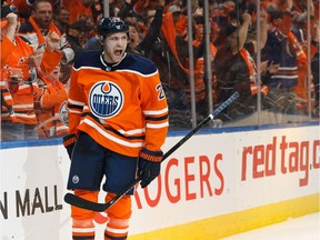 Edmonton Oilers' Leon Draisaitl (29) celebrates a goal on Vancouver Canucks' goaltender Jacob Markstrom (25) during first period NHL action at Rogers Place in Edmonton, on Wednesday, Oct. 2, 2019.