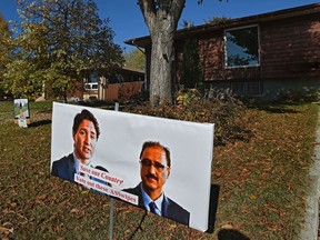 Two election signs are posted on a homeowner's front lawn displaying Liberal Leader Justin Trudeau and candidate Amarjeet Sohi in Mill Woods on Thursday, Oct. 3, 2019.