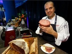 Antonio Tardi, senior executive chef at Rogers Place, makes a "grandma's plate" of choice charcuterie with finocchiona, a Tuscan style salami, during a media reveal of new food and beverage options for Rogers Place at Studio 99 in Edmonton, on Thursday, Oct. 3, 2019.