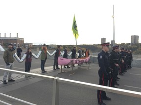 Climate activists block one of the city's major arteries into downtown Edmonton during the Monday morning commute.  Starting at 7 a.m. activists with Extinction Rebellion Edmonton, began using "non-violent direct action to prevent catastrophic climate and ecological breakdown" to block traffic along the Walterdale Bridge.