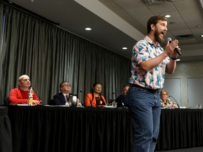 Rhinoceros Party candidate Donovan Eckstrom gives an enthusiastic introduction to his platform during an Edmonton Centre federal election forum at Matrix Hotel on Thursday, Oct. 10, 2019. Photo by Ian Kucerak/Postmedia
